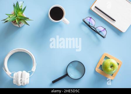 Flat lay, hobby, study and work concept on blue background. Stock Photo