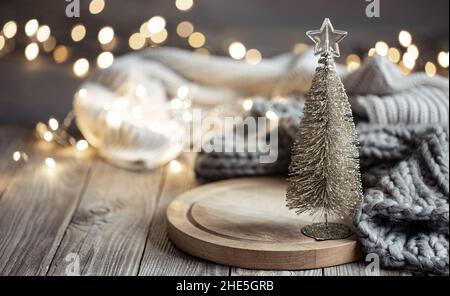 Decorative Christmas tree on blurred background with bokeh. Stock Photo