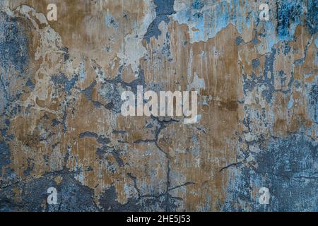 Texture and color of the old concrete wall that be eroded. Background of old brown painted wall, close up. Brown wall on the street, vintage style Stock Photo