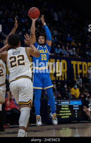 UCLA guard Tyger Campbell (10) shoots the basketball against California forward Andre Kelly (22) during the first half in Berkeley, California, Saturd Stock Photo