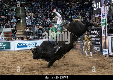 New York, NY - January 8, 2022: Cooper Davis of Jasper, Texas rides a bull during 2nd day of PBR Unleash The Beast at Madison Square Garden Stock Photo