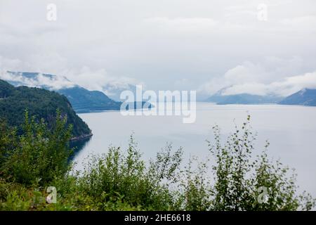 Scenic panorama view of norwegian beautiful nature and small fishing villages with typical rorbu wooden red cabins in Lofoten, northern Norway Stock Photo