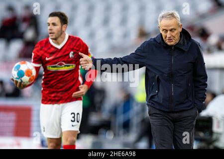 Freiburg Im Breisgau, Germany. 08th Jan, 2022. Soccer: Bundesliga, SC Freiburg - Arminia Bielefeld, Matchday 18, Europa-Park Stadion. Freiburg's coach Christian Streich (r) gestures. On the left is Freiburg's Christian Günter (l). Credit: Tom Weller/dpa/Alamy Live News Stock Photo