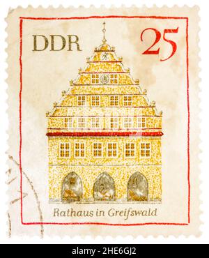 Stamp printed in German Democratic Republic (East Germany) shows Greifswald town hall Stock Photo