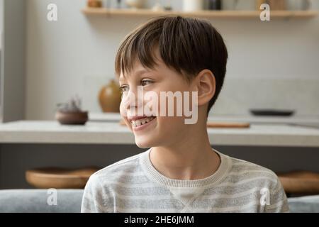 Happy thoughtful teenage boy with dental braces Stock Photo