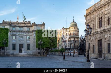 A look across the deserted cobbled Plaza de San Francisco towards the lovely 'Confiteria Filella' on the 'Avenida de la Constitucion', Seville, Spain Stock Photo