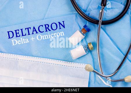 Light blue medical background with Deltacron (Delta and Omicron) text, vaccine bottles and stethoscope. New infectious covid-19 disease variant concep Stock Photo