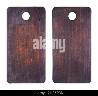 Top view of two kitchen old cutting boards. Dark cutting boards isolated on white background Stock Photo