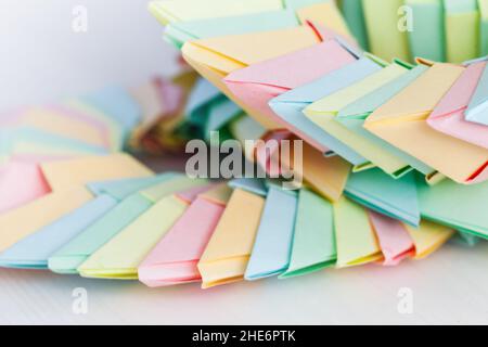 Origami background, parametric round structures of colorful paper sheets, close up photo with selective focus Stock Photo