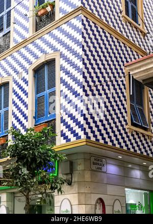 Building covered in blue and white ceramic tiles, Gibralter Stock Photo