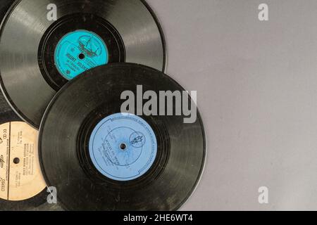 Vinyl records from 1950-1970 on a gray background. Old Soviet songs on worn gramophone records. Kiev, Ukraine - 04 15 2021 Stock Photo