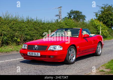 1999 90s nineties red Mercedes Benz SL CLK320 Elegance 3199cc n5 speed automatic en-route to Capesthorne Hall classic July car show, Cheshire, UK Stock Photo