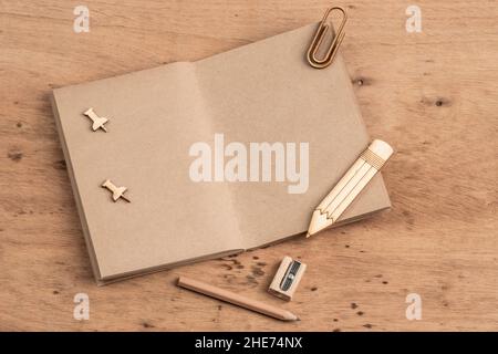 a blank notebook opened on a wooden table with copy space Stock Photo