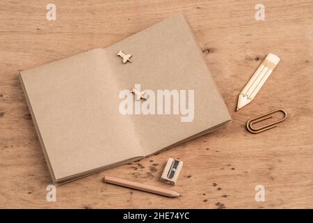 a blank notebook opened on a wooden table with copy space Stock Photo