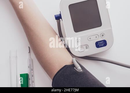 Blood pressure measurement, digital gauge medical equipment isolated on  white background. Health and medicine concept Stock Photo - Alamy