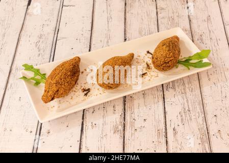 Kibbeh, known as içli köfte in Turkish, is a very common food throughout the Middle East and part of the Caucasus as well as Armenia Stock Photo