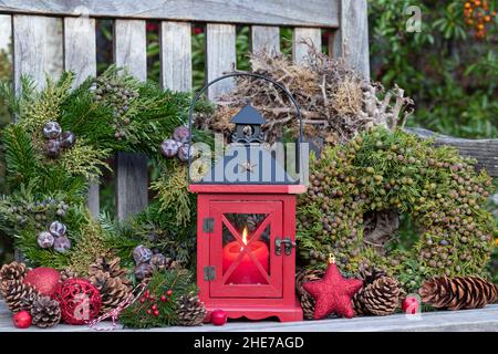 christmas decoration with red wooden lantern and advent wreath Stock Photo