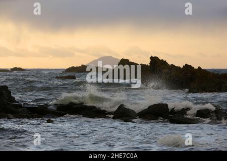 Dunure, Ayrshire, Scotland, UK Waves crashing onto the rocky shore on a winters day on the Ayrshire Coast , Firth of Clyde Stock Photo