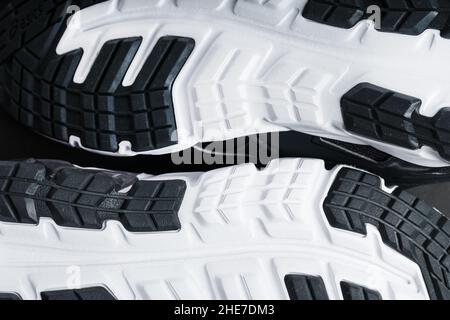 The sole of the sports sneakers for running in black and white close-up. Sports technology Stock Photo