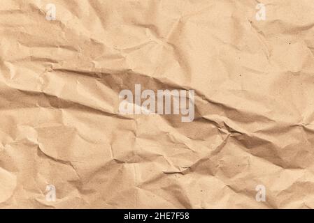 Crumpled brown paper texture. Kraft recycled paper background Stock Photo