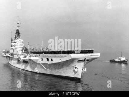 HMS Theseus R64 Colossus class aircraft carrier a warship of the British Royal Navy Stock Photo