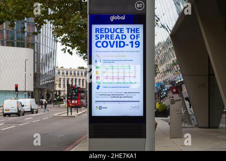 DOOH, digital out of home by Global and BT, Reduce the spread of covid 19 e board, advert, digital signage display, street sign, london, uk Stock Photo