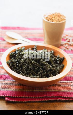 Image showcasing Gluten free fusilli pasta with green pea and carrot made of whole grain ...