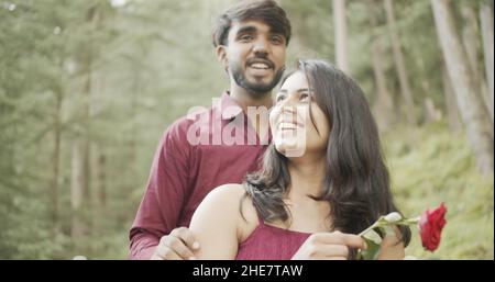 Young Indian couple having a fun date at a park Stock Photo