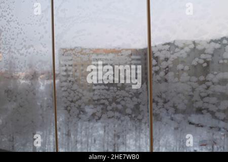 frosty patterns on window panes in winter Stock Photo