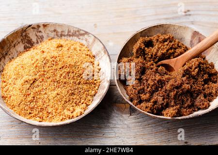 soft brown dark sugar and unrefined sugar cane in bowls Stock Photo