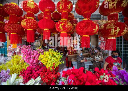 Kuala Lumpur, Malaysia. 09th Jan, 2022. Shoppers wearing face masks as a preventive measure against the spread of Covid-19 are seen near the Chinese Lunar New Year decorations. Chinese around the world will be celebrating the Chinese Lunar New Year and welcome the year of Tiger which falls on February 1, 2022. (Photo by Wong Fok Loy/SOPA Images/Sipa USA) Credit: Sipa USA/Alamy Live News Stock Photo