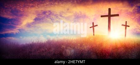 Three Crosses On A Hill At Sunset - Crucifixion Of Jesus Christ Stock Photo