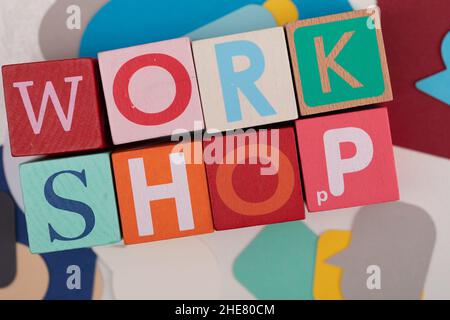 Closeup of word workshop seminar of colorful wood cubes Stock Photo