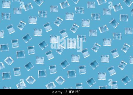 Pattern from ice cubes on a blue background. Top view of simulated ice cubes. Stock Photo