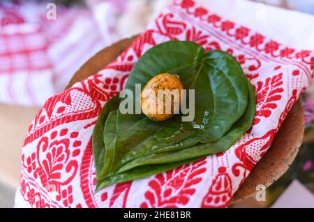 Guwahati, Assam, India. January 9, 2022: Tamul-Paan (Areca Nut and Betel Leaf) displayed on Assamse traditional Gamosa at a Bhogali Mela ahead of Bhogali Bihu Festival in Guwahati, Assam, India on Sunday, Jan. 9, 2022. Tamul-Paan is a highly honorary and significant combination in Assamese society. Bhogali Bihu or Magh Bihu is celebrated during the month of January which marks the end of the harvest season. (Credit Image: © David Talukdar/ZUMA Press Wire) Credit: ZUMA Press, Inc./Alamy Live News Stock Photo