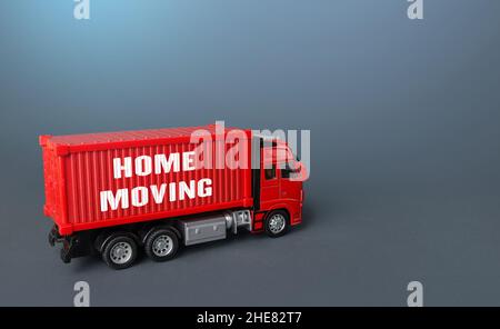 Home moving truck transporting company. Delivery services to another house. Relocation to a new housing. Transportation and delivery of things and fur Stock Photo