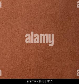 Fragment of synthetic dense and smooth light brown material Stock Photo