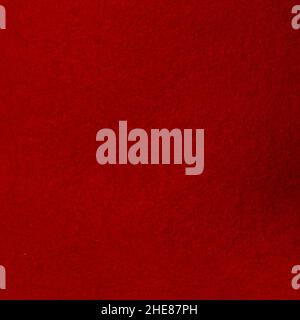 Fragment of synthetic dense and smooth very dark red material Stock Photo