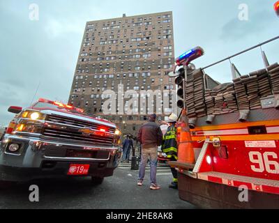 New York City, USA. 9th Jan, 2022. People are seen in front of the apartment building in Bronx, New York, the United States, on Jan. 9, 2022. At least 19 people, including nine children, lost their lives in a major fire in New York City on Sunday, various U.S. media outlets reported. Credit: Michael Nagle/Xinhua/Alamy Live News Stock Photo