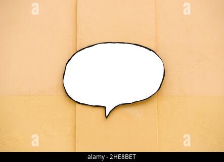 Top view of speech balloon bubble sign copy space on light orange background Stock Photo