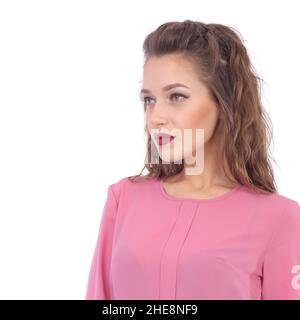 pretty young woman wearing pink blouse and dark office skirt Stock Photo