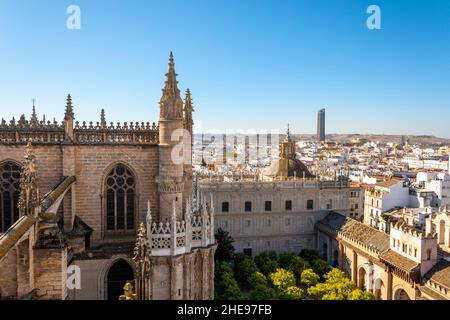 View from the Giralda Tower out over the courtyard of the Seville Cathedral with the city and Sevilla Tower Skyscraper in view. Stock Photo