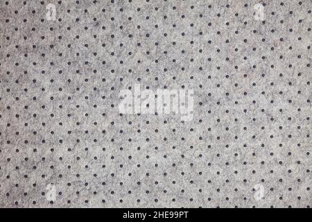 Grey felt material background with dark dots Stock Photo