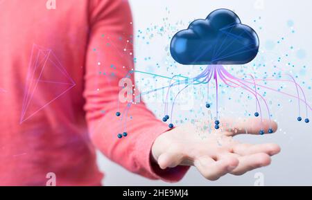 Shallow focus of a human hand holding a cloud icon, cloud computing and big data concept Stock Photo