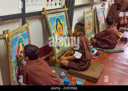 Students painting tangka in a technical vocational school, Thimphu, Bhutan Stock Photo