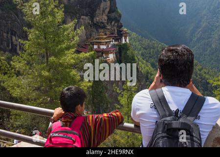 Tourists photographing Paro Taktsang (also known as Tiger's Nest), Paro, Bhutan Stock Photo