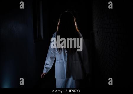Scary ghost in white dress halloween theme Stock Photo