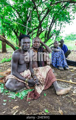 Omo River Valley, Ethiopia, November 2020, Men in traditional outfits from the Mursi tribe Stock Photo
