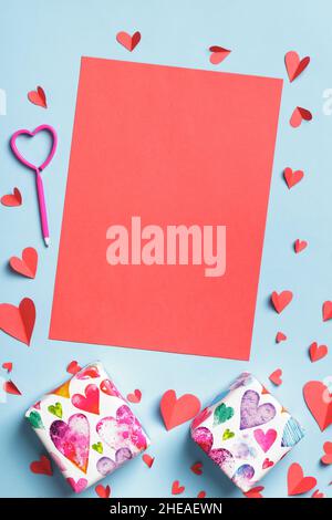 Valentine day concept. Blank paper sheet of hearts gift on a blue background. Stock Photo