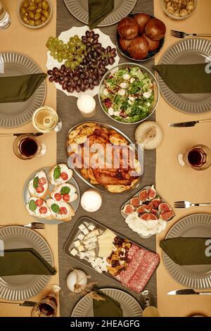 High angle view of dining table with turkey and salads on it for dinner party Stock Photo